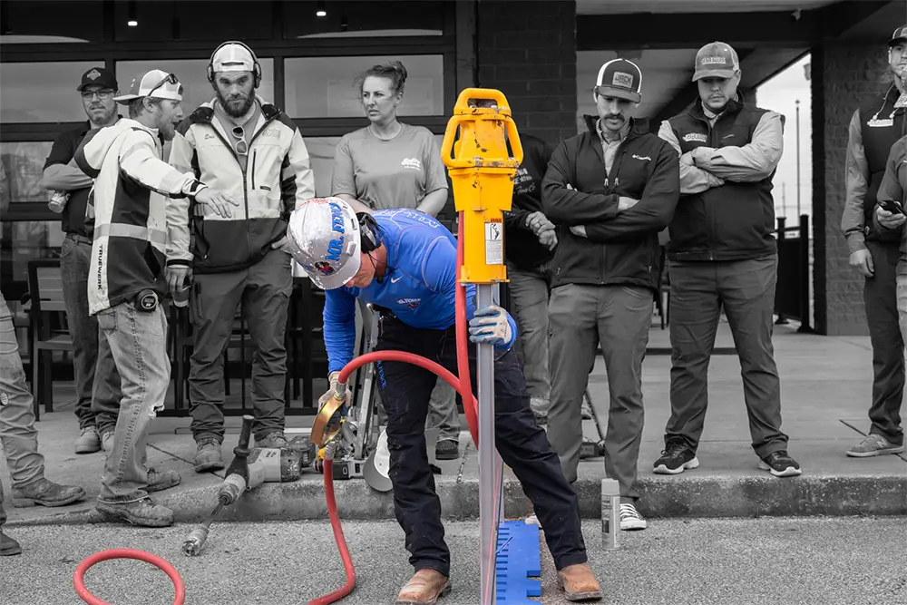 Contractors watching an i Drive Power System installation demonstration at a training event