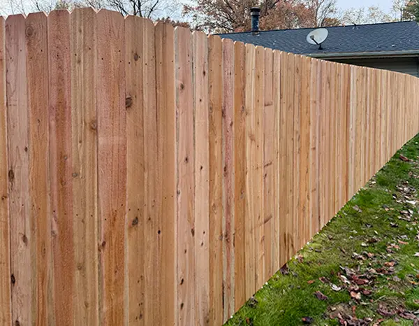 Wood fence installed with i Drive Power System steel posts